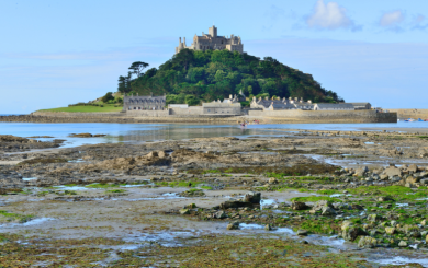 St Michael's Mount in Penzance with the tide out and blue sky