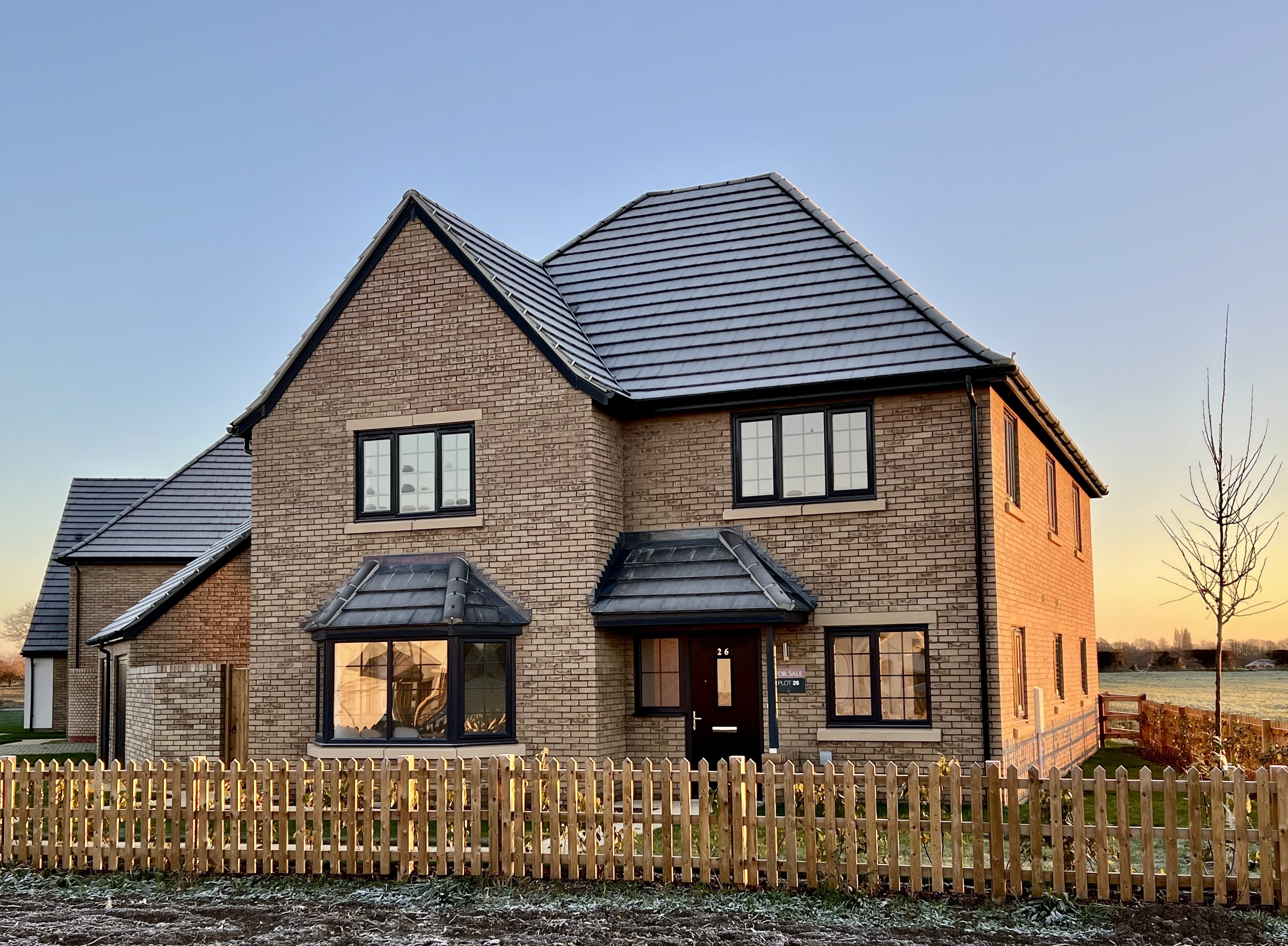 A large 5 bedroom home on a winters day with frost on the roof