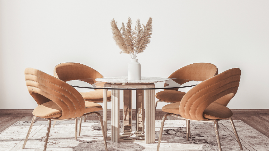 A minimal room with a glass dining table and trendy dining chairs 